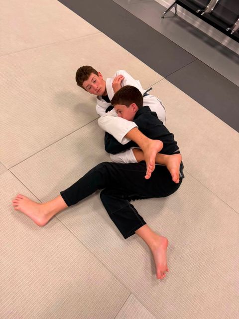 Two Kids & Teen BJJ students drilling Brazilian Jiu-Jitsu in the gi at Gustavo Machado BJJ Venice