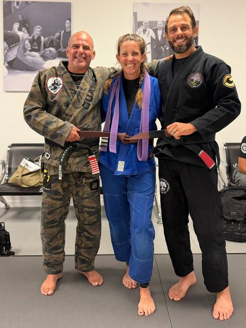 Germaine promoted to brown belt by Gustavo Machado and David Valentine