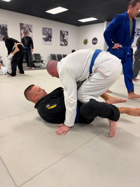 Adult students training Brazilian Jiu-Jitsu at the Venice FL academy